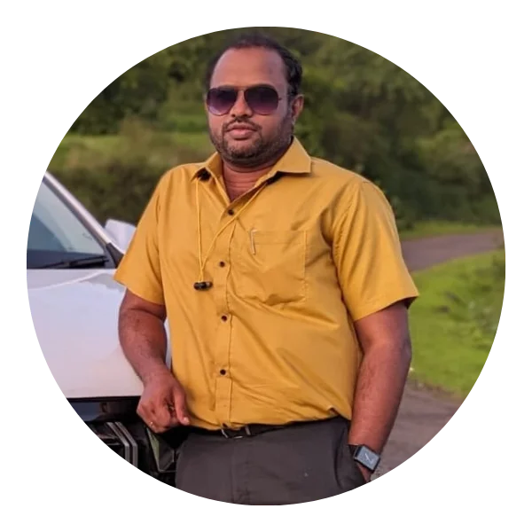 Vinay Pol standing near a bookshelf
